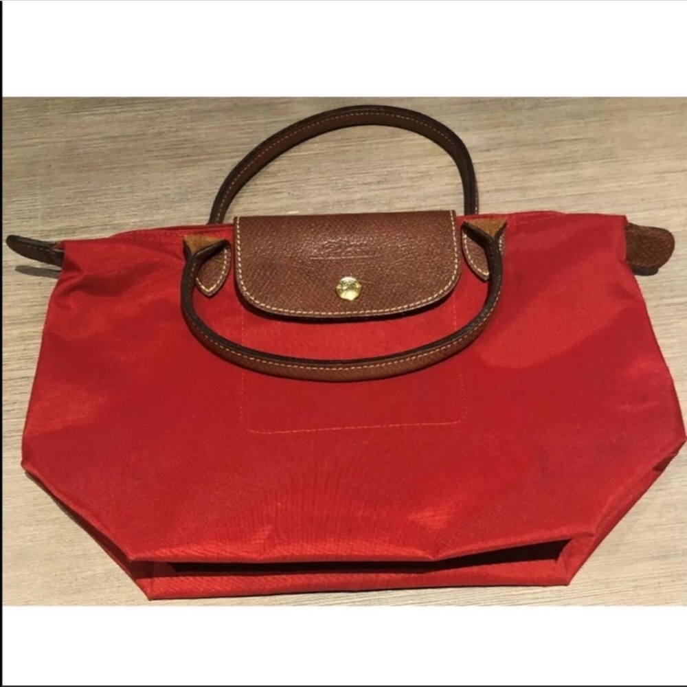 Red and brown longchamp bag
Mini